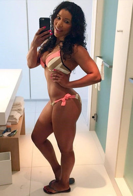 Leggy beauty in a narrow bikini posing