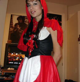 Young wife posing in little red riding